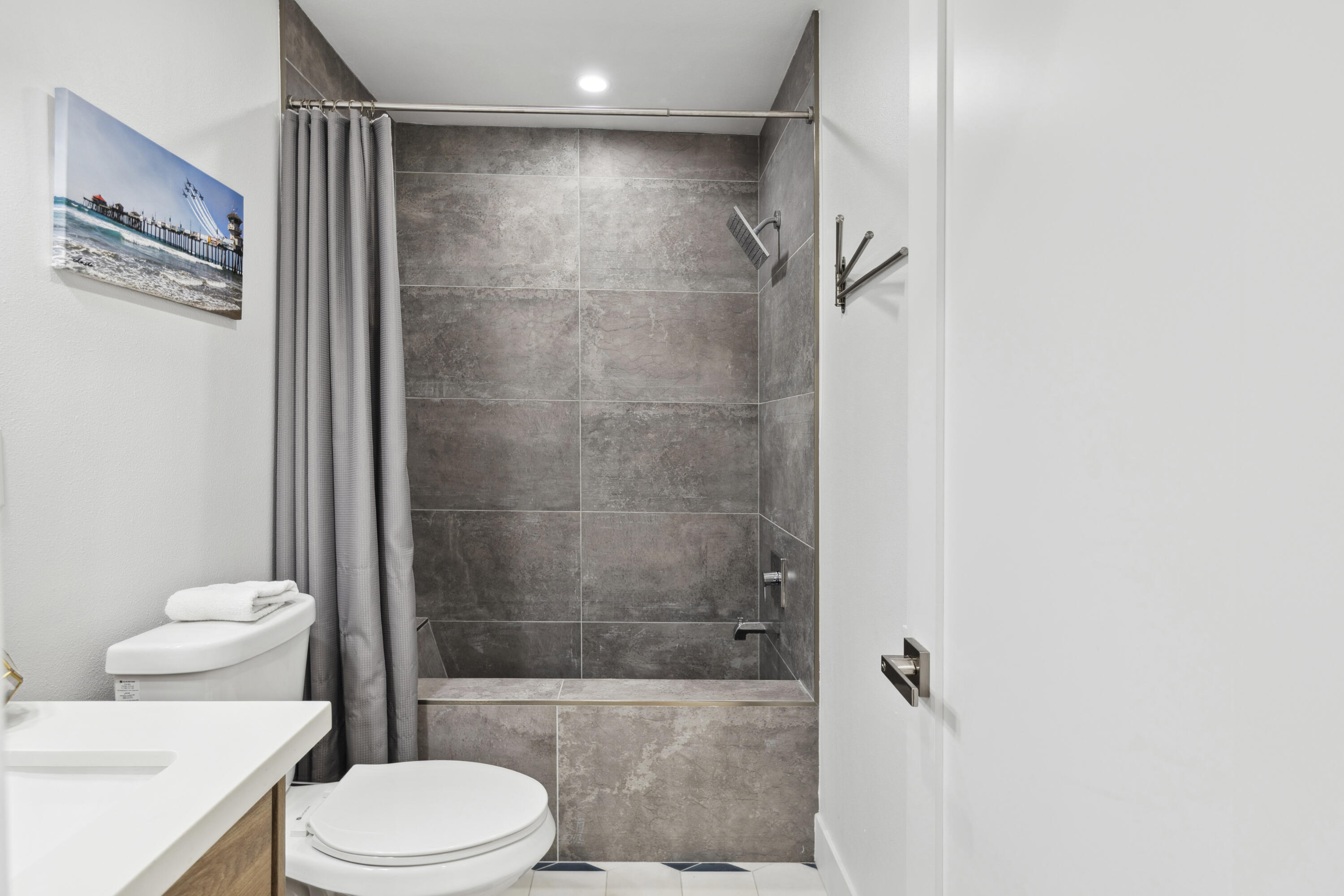 711 Pacific Coast Highway, Unit 206 Huntington Beach, CA 92648 - Photo 13 of 32 a bathroom with a shower and a toilet