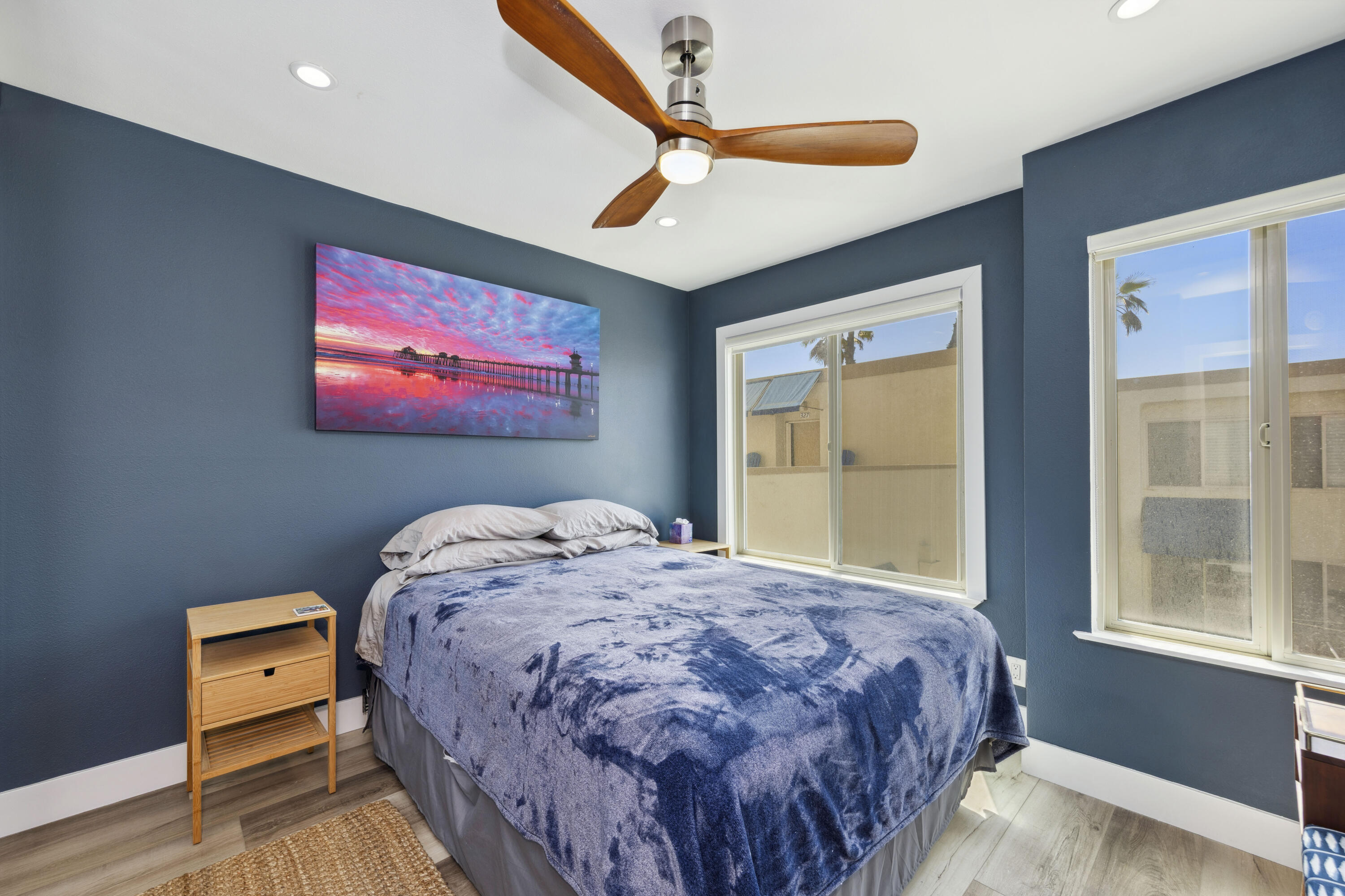 711 Pacific Coast Highway, Unit 206 Huntington Beach, CA 92648 - Photo 15 of 32 a bedroom with a bed and a window