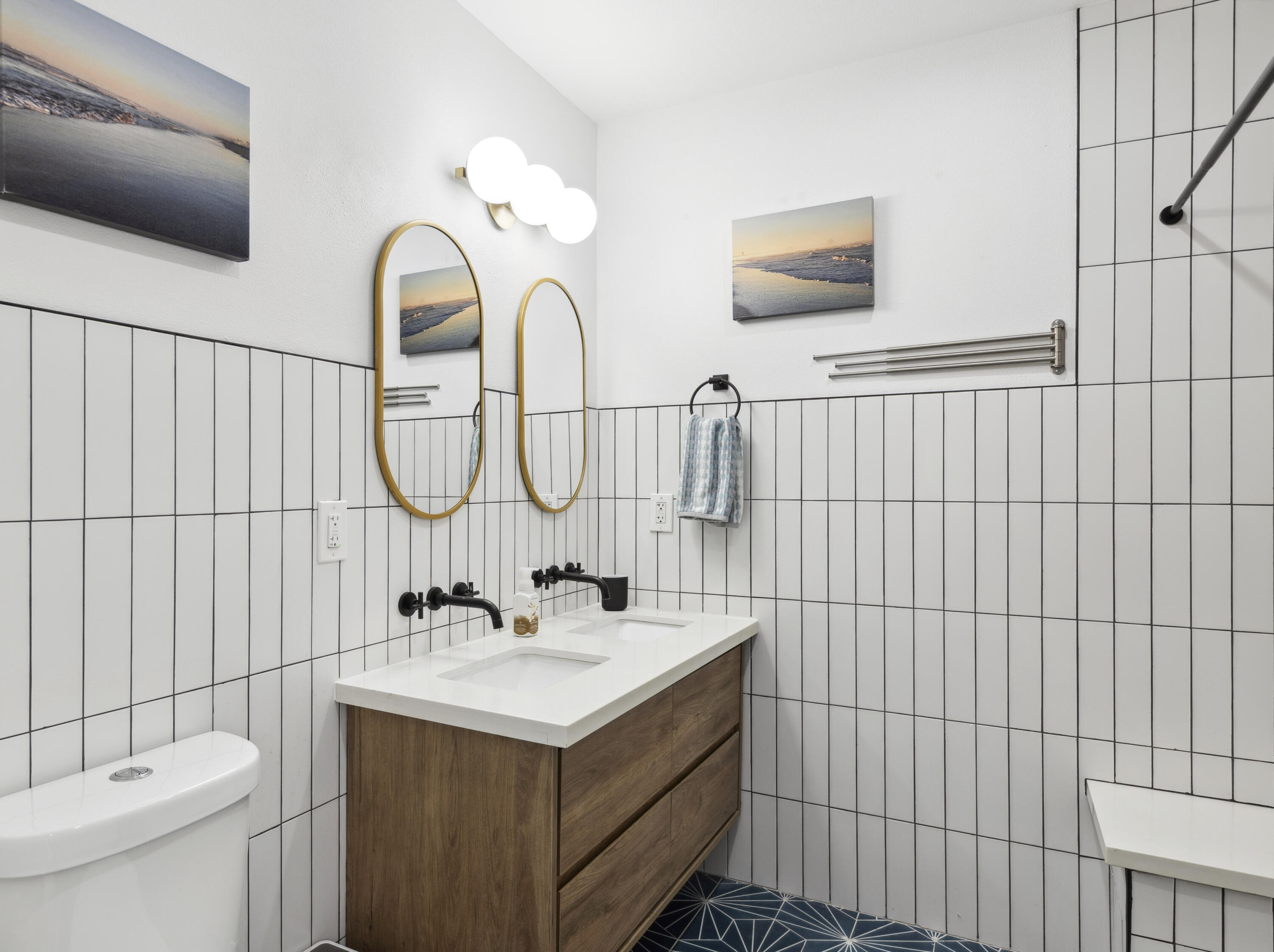 711 Pacific Coast Highway, Unit 206 Huntington Beach, CA 92648 - Photo 17 of 32 a bathroom with a sink a toilet and shower