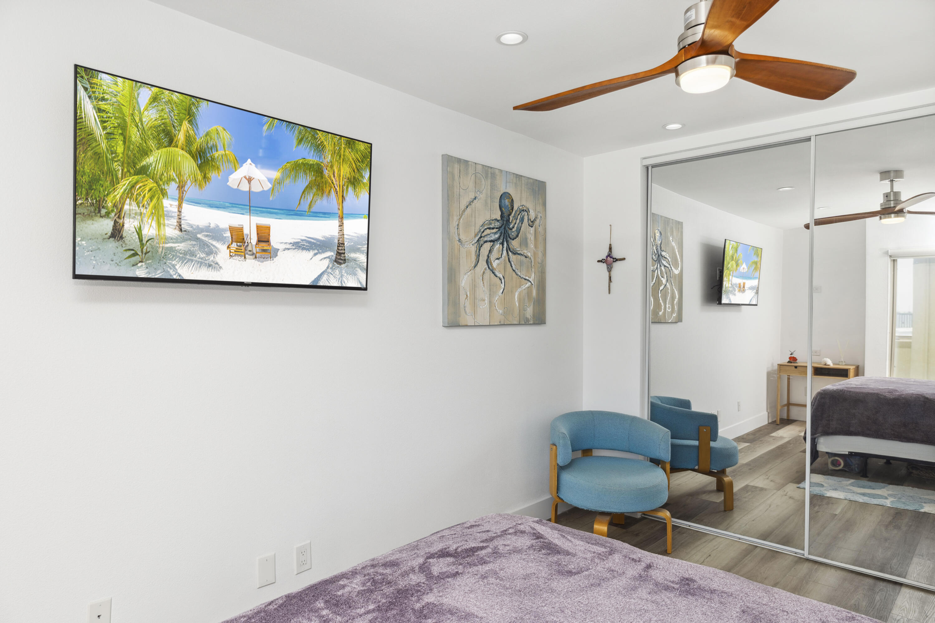 711 Pacific Coast Highway, Unit 206 Huntington Beach, CA 92648 - Photo 19 of 32 a living room with furniture and a painting on the wall