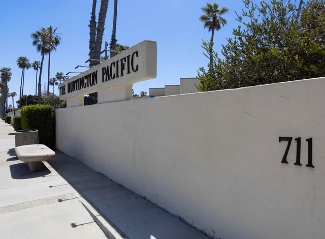a view of a house with a sink and potted plants