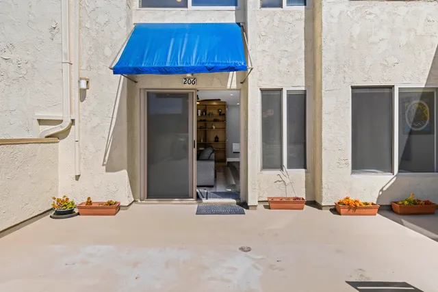 an outdoor view of house with garage