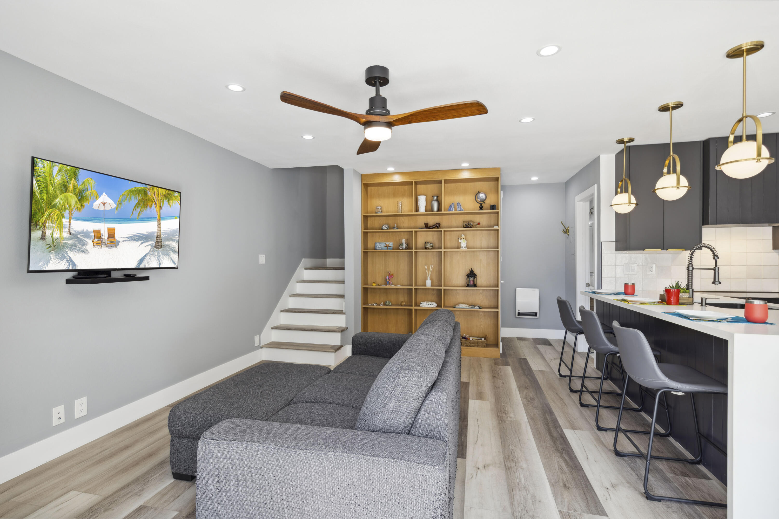 711 Pacific Coast Highway, Unit 206 Huntington Beach, CA 92648 - Photo 5 of 32 a living room with furniture and a large window