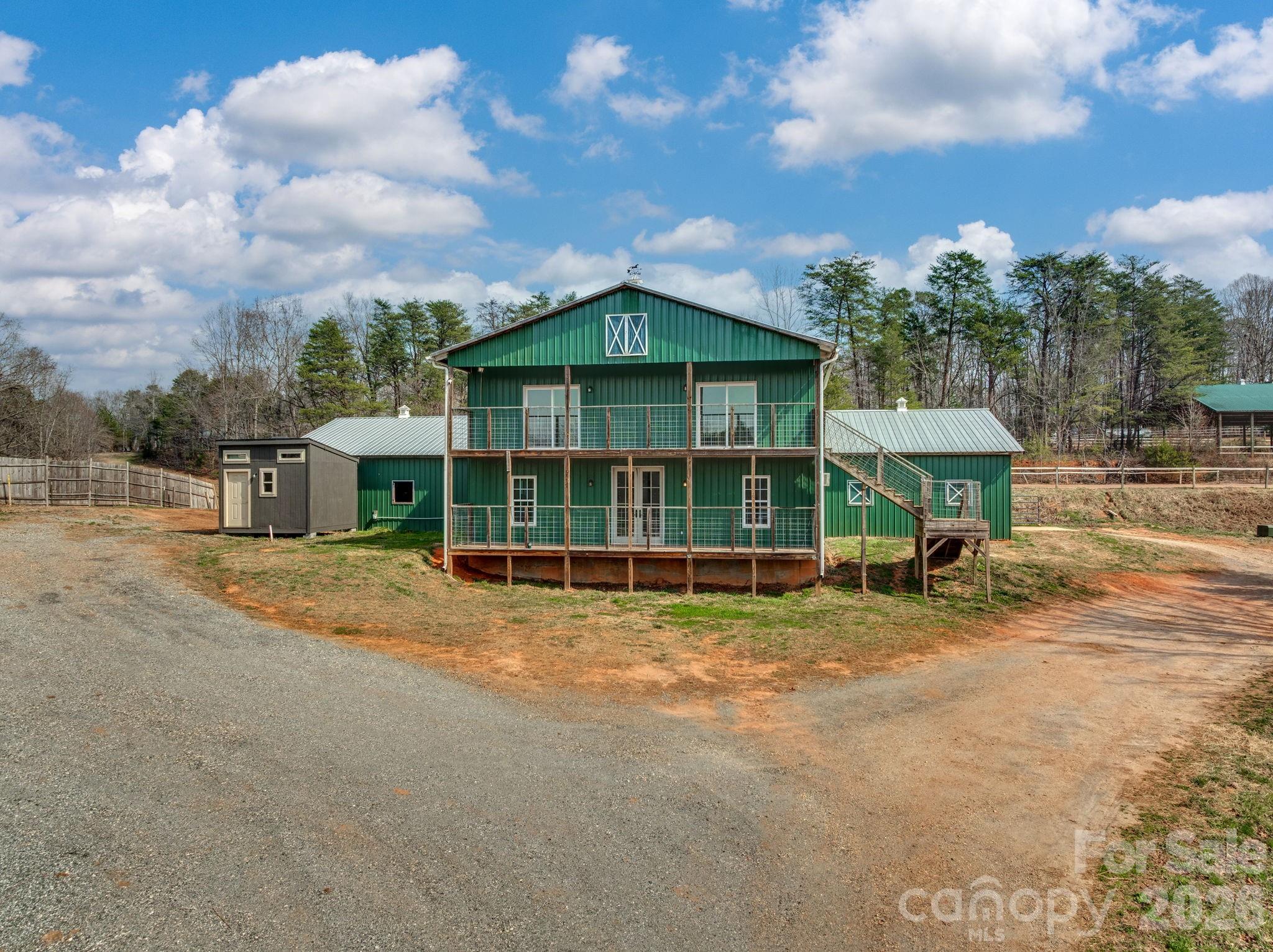 1487 Hayes Road Columbus, NC 28722 - Photo 1 of 48 a view of a house with a yard and sitting area