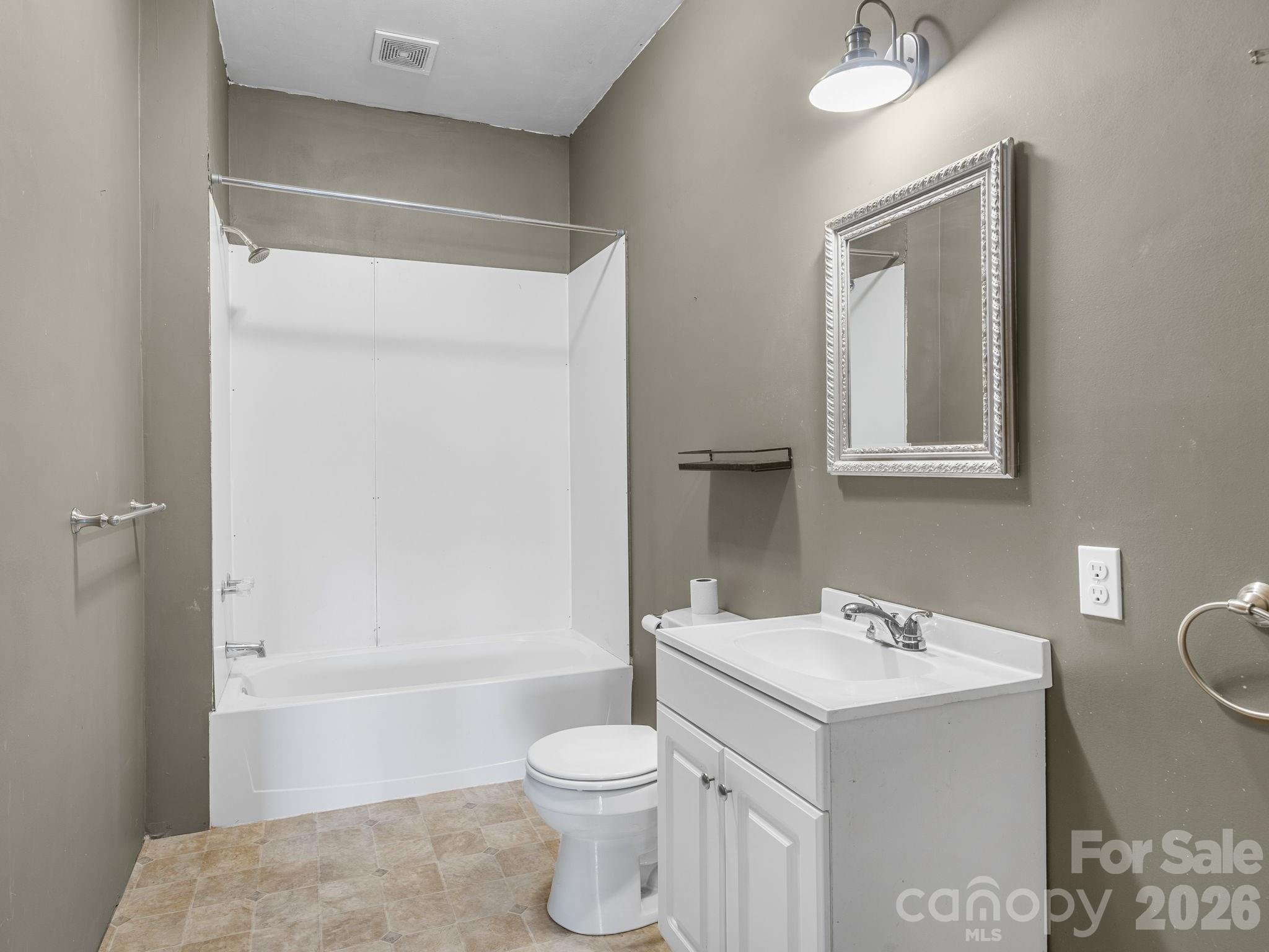 1487 Hayes Road Columbus, NC 28722 - Photo 18 of 48 a bathroom with a sink toilet and shower