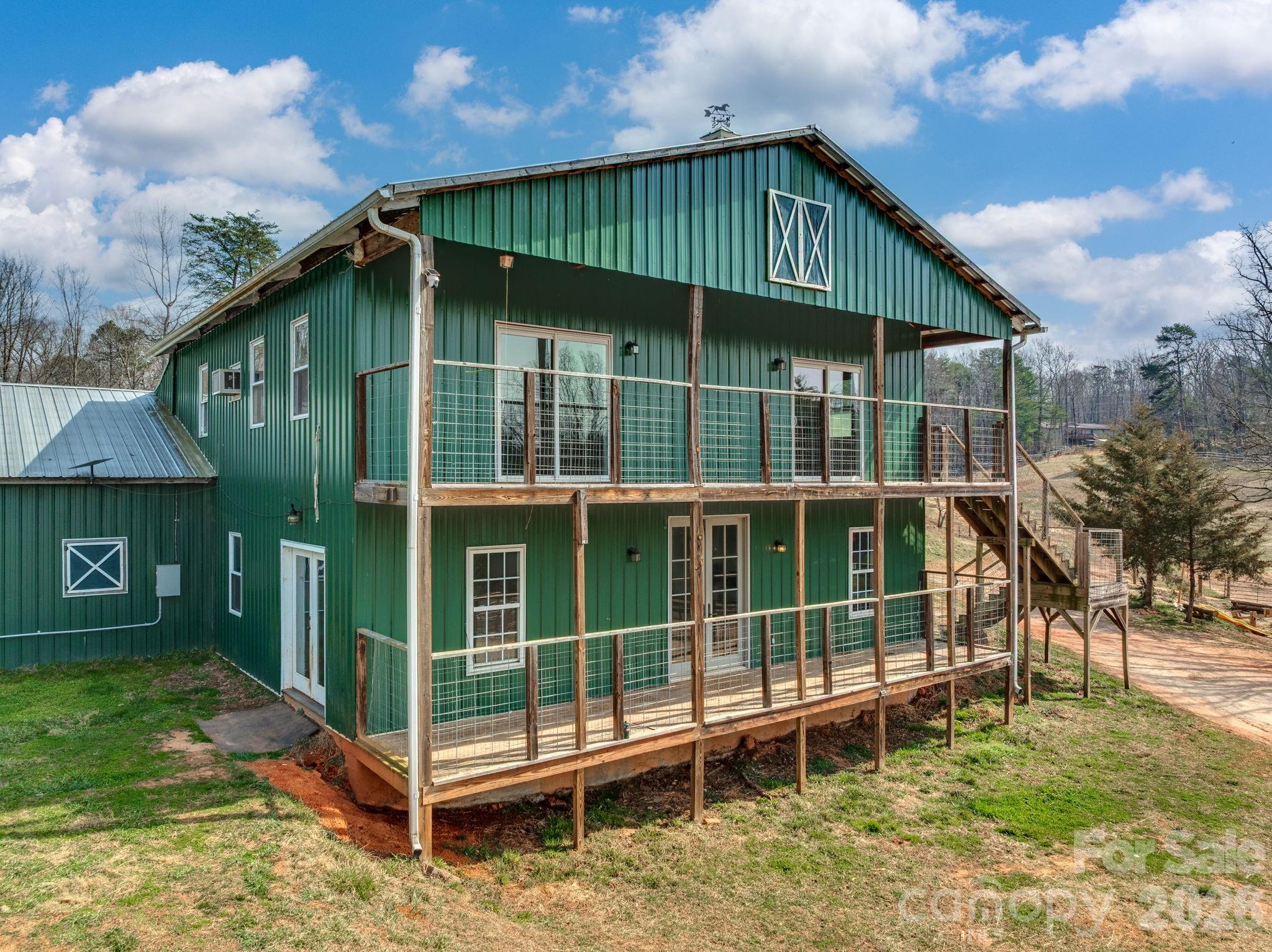 1487 Hayes Road Columbus, NC 28722 - Photo 2 of 48 a view of a house with a yard and potted plants