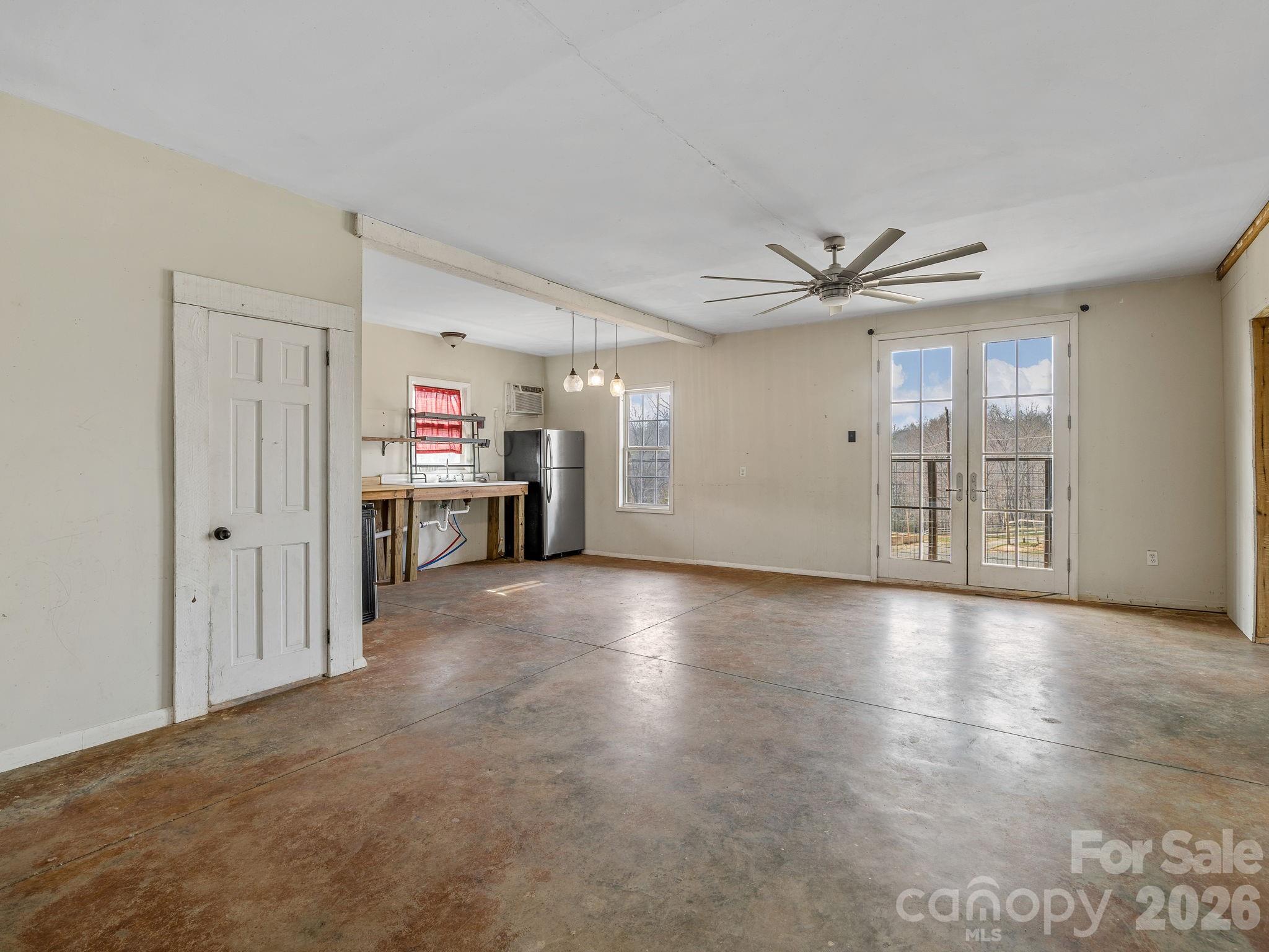 1487 Hayes Road Columbus, NC 28722 - Photo 27 of 48 a view of a livingroom with a ceiling fan and window