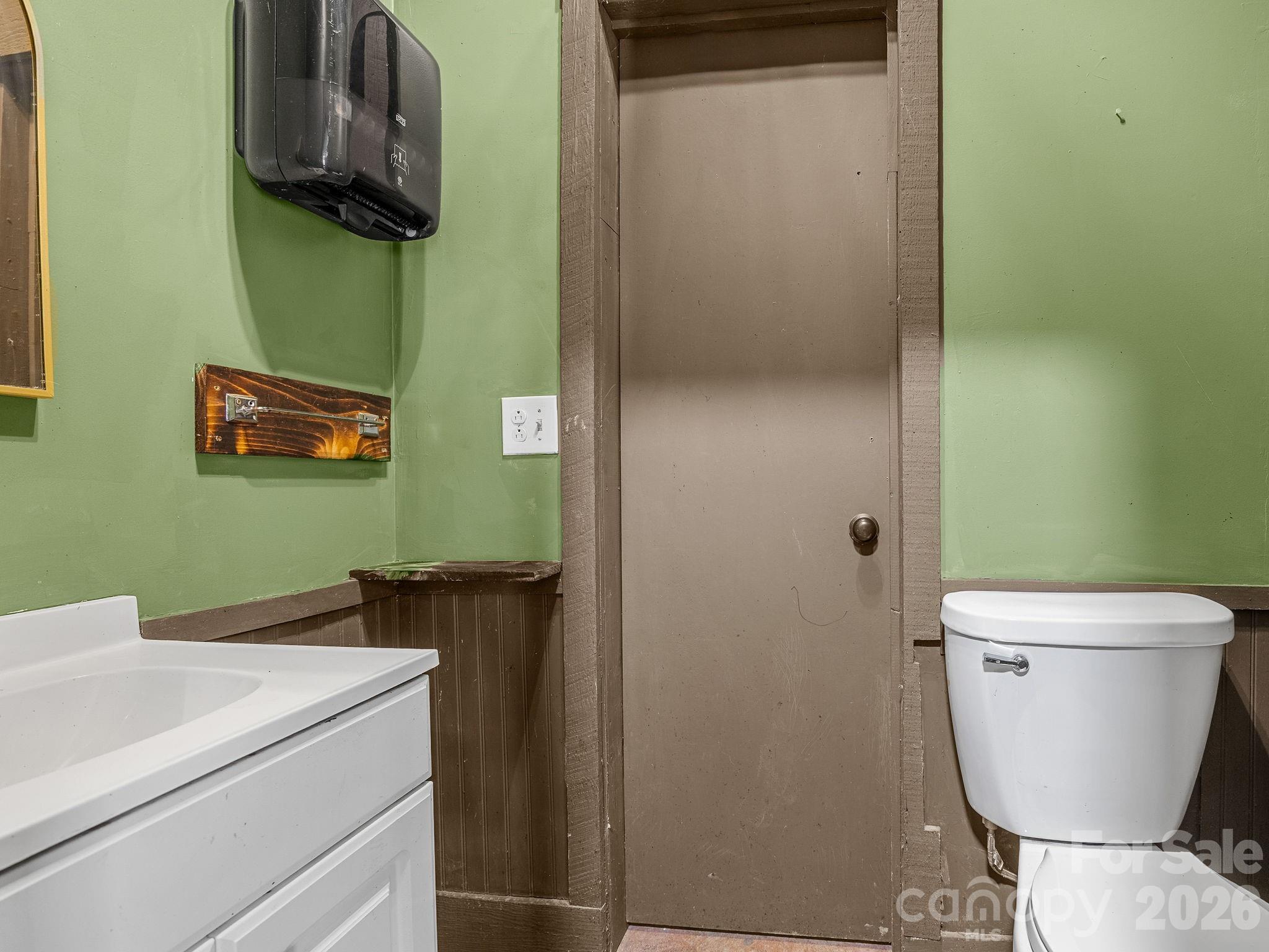 1487 Hayes Road Columbus, NC 28722 - Photo 30 of 48 a bathroom with a toilet and a sink