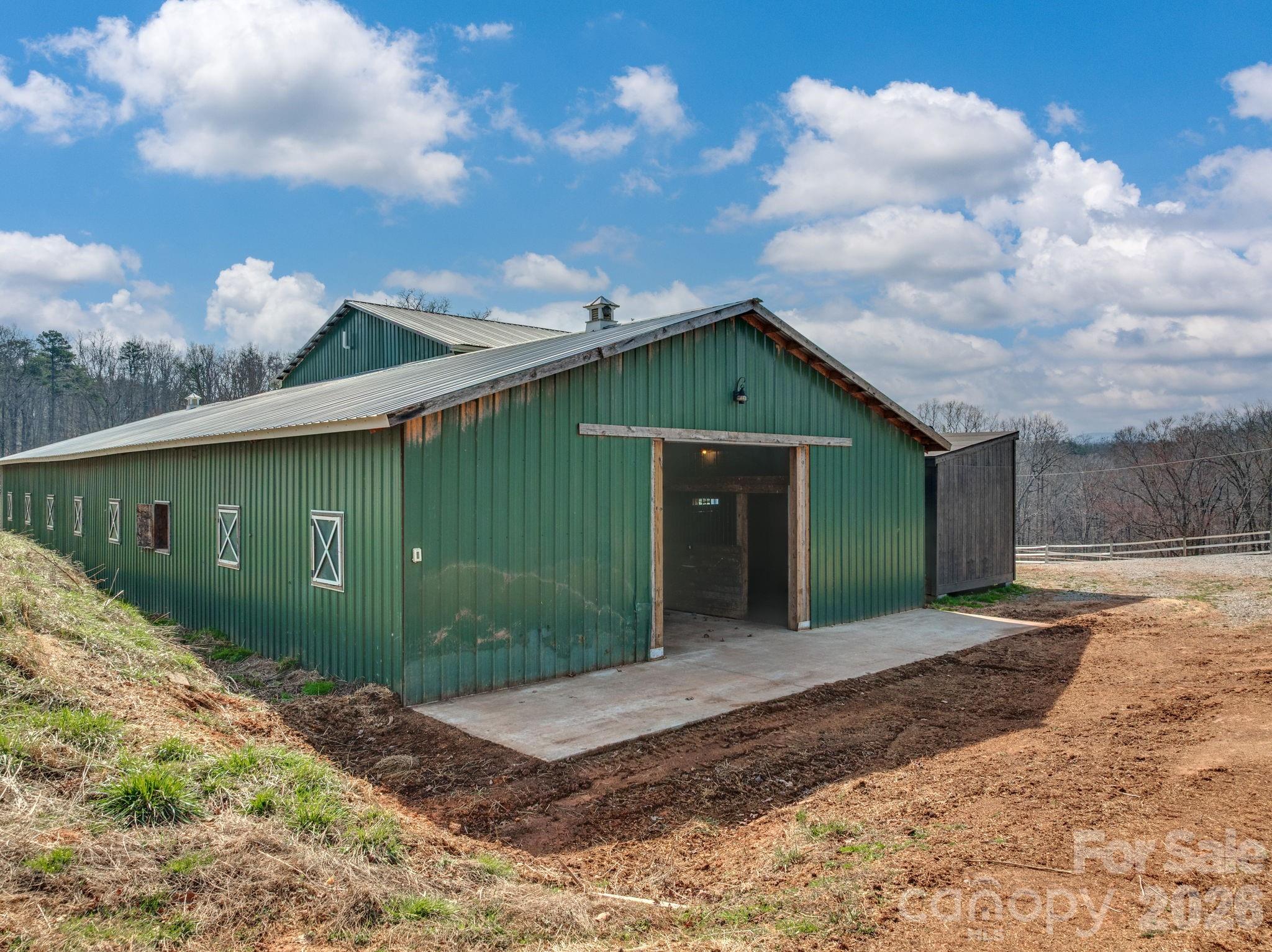 1487 Hayes Road Columbus, NC 28722 - Photo 33 of 48 a backyard of a house with a yard and garage