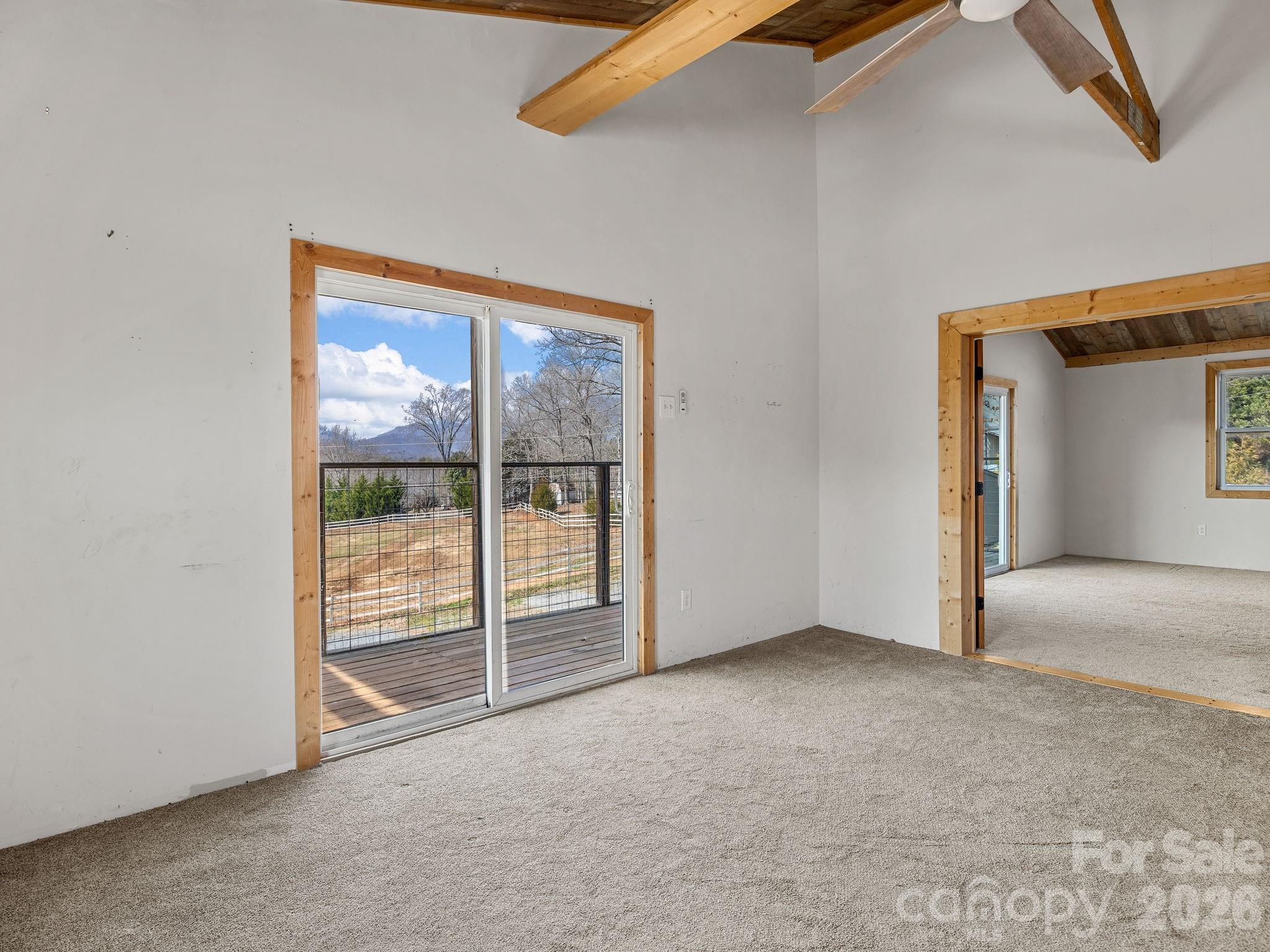 1487 Hayes Road Columbus, NC 28722 - Photo 5 of 48 an empty room with sliding door