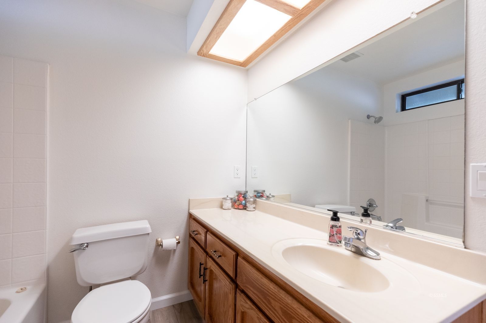 616 Yellow Astor Avenue Ridgecrest, CA 93555 - Photo 18 of 29 a bathroom with a toilet sink and mirror