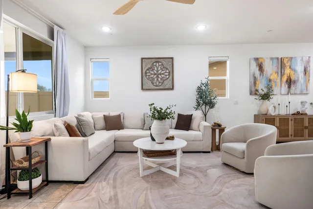 a spacious bathroom with a shower sink and mirror