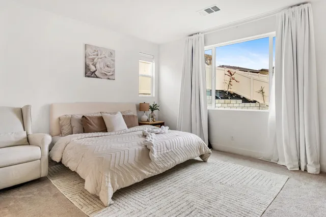 a bathroom with a bathtub a sink and a mirror