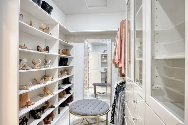 a view of a backyard with table and chairs with a swimming pool