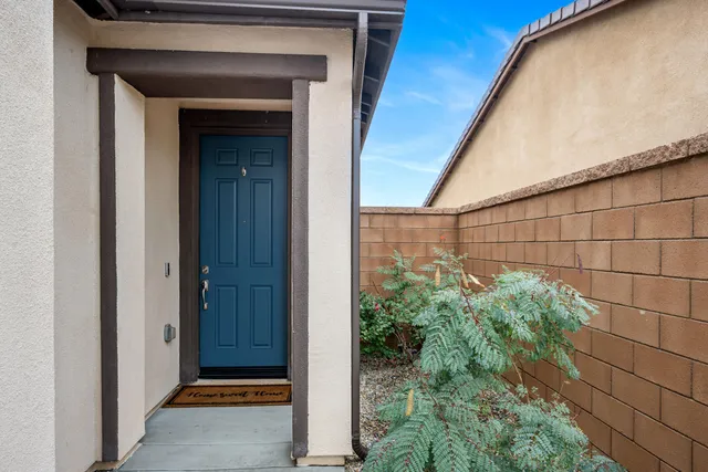 a kitchen with kitchen island granite countertop a sink a stove and cabinets