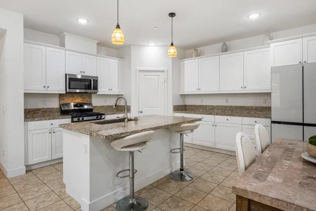 a living room with fireplace furniture and a flat screen tv