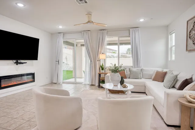 a bedroom with a bed and a flat tv screen in it