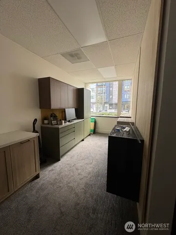 a kitchen with a sink and a refrigerator