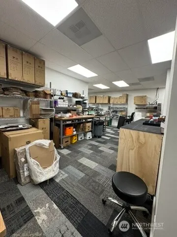 a kitchen with a sink a stove and cabinets