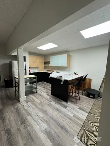 a living room with stainless steel appliances kitchen island granite countertop furniture and a kitchen view