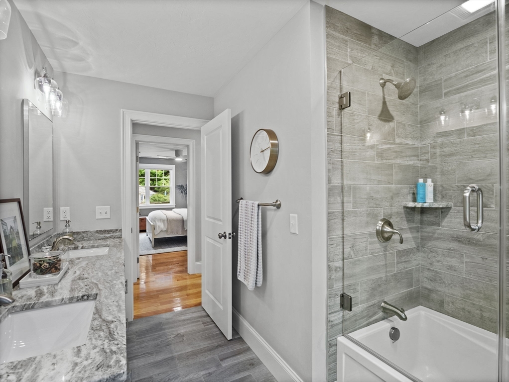 3 Mooney Road Burlington, MA 01803 - Photo 19 of 34 a bathroom with a tub sink and mirror
