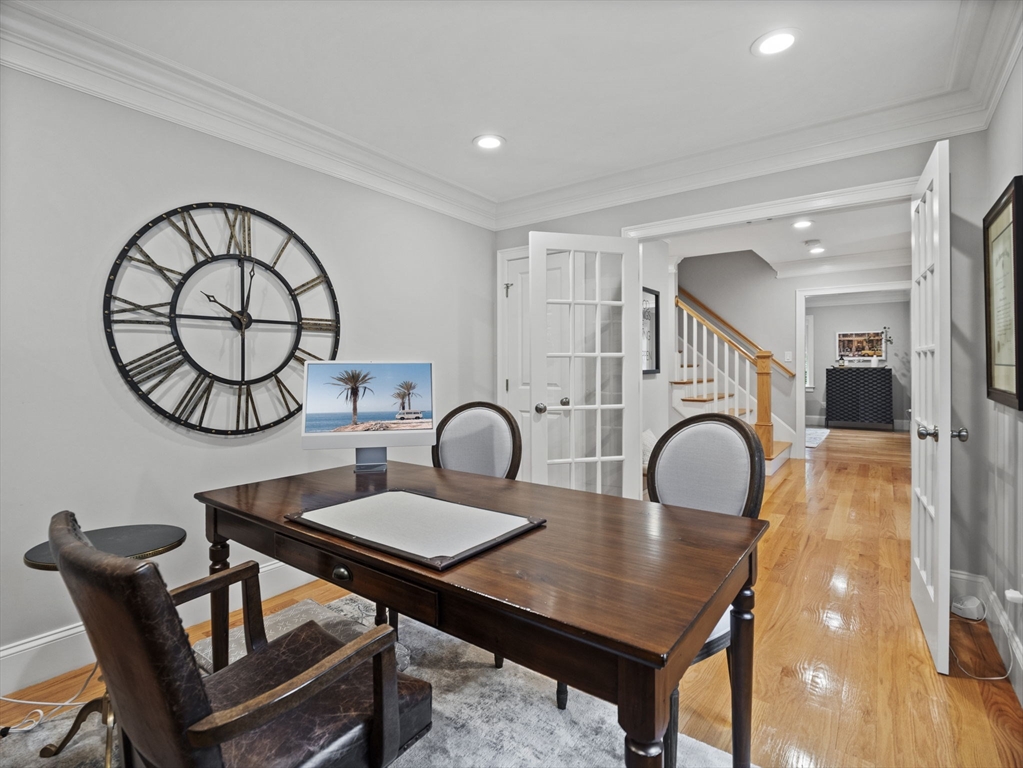 3 Mooney Road Burlington, MA 01803 - Photo 2 of 34 a dining room with furniture a rug and a potted plant