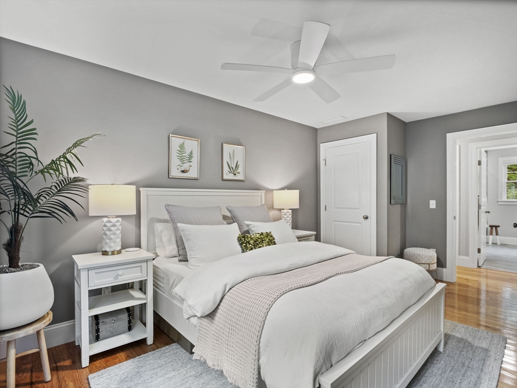 3 Mooney Road Burlington, MA 01803 - Photo 21 of 34 a bedroom with a bed and a chandelier