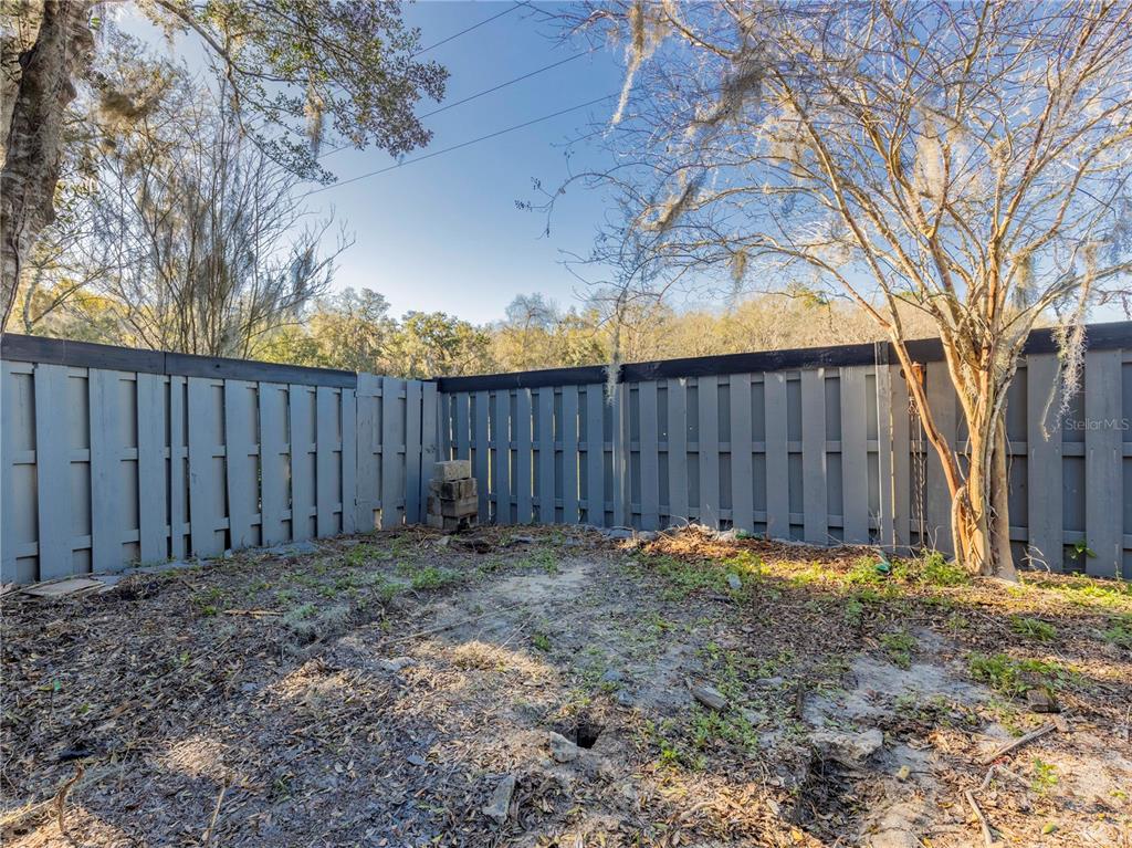 4356 Southwest 20th Lane Gainesville, FL 32607 - Photo 15 of 15 a backyard of a house