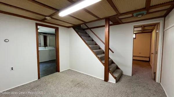 a view of an empty room with stairs