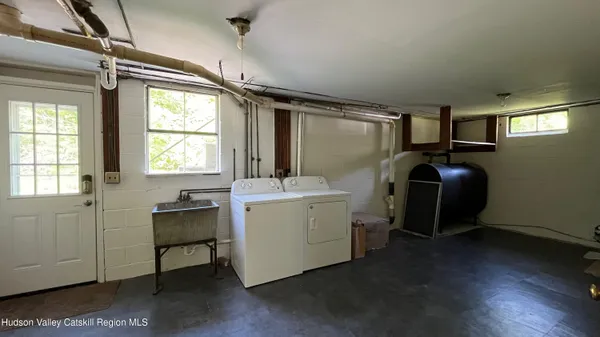 a room with wooden floor and furniture