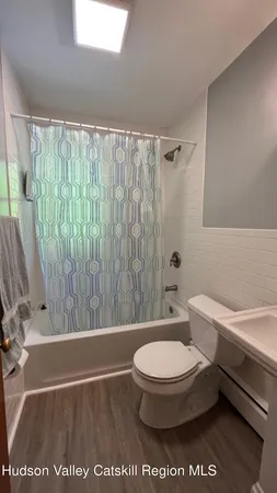 a bathroom with a toilet a sink and a bathtub