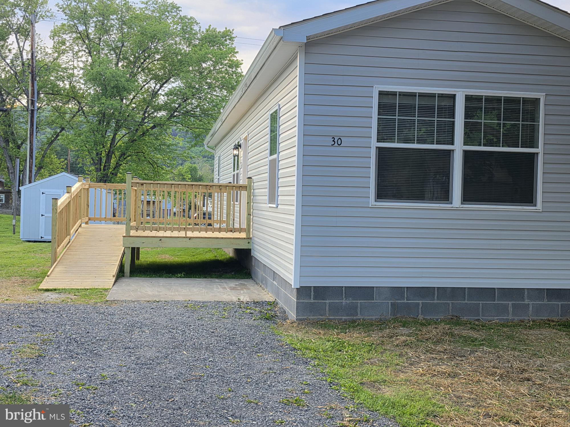 30 South Skyline Drive Ridgeley, WV 26753 - Photo 4 of 15 a view of a house with backyard and sitting area