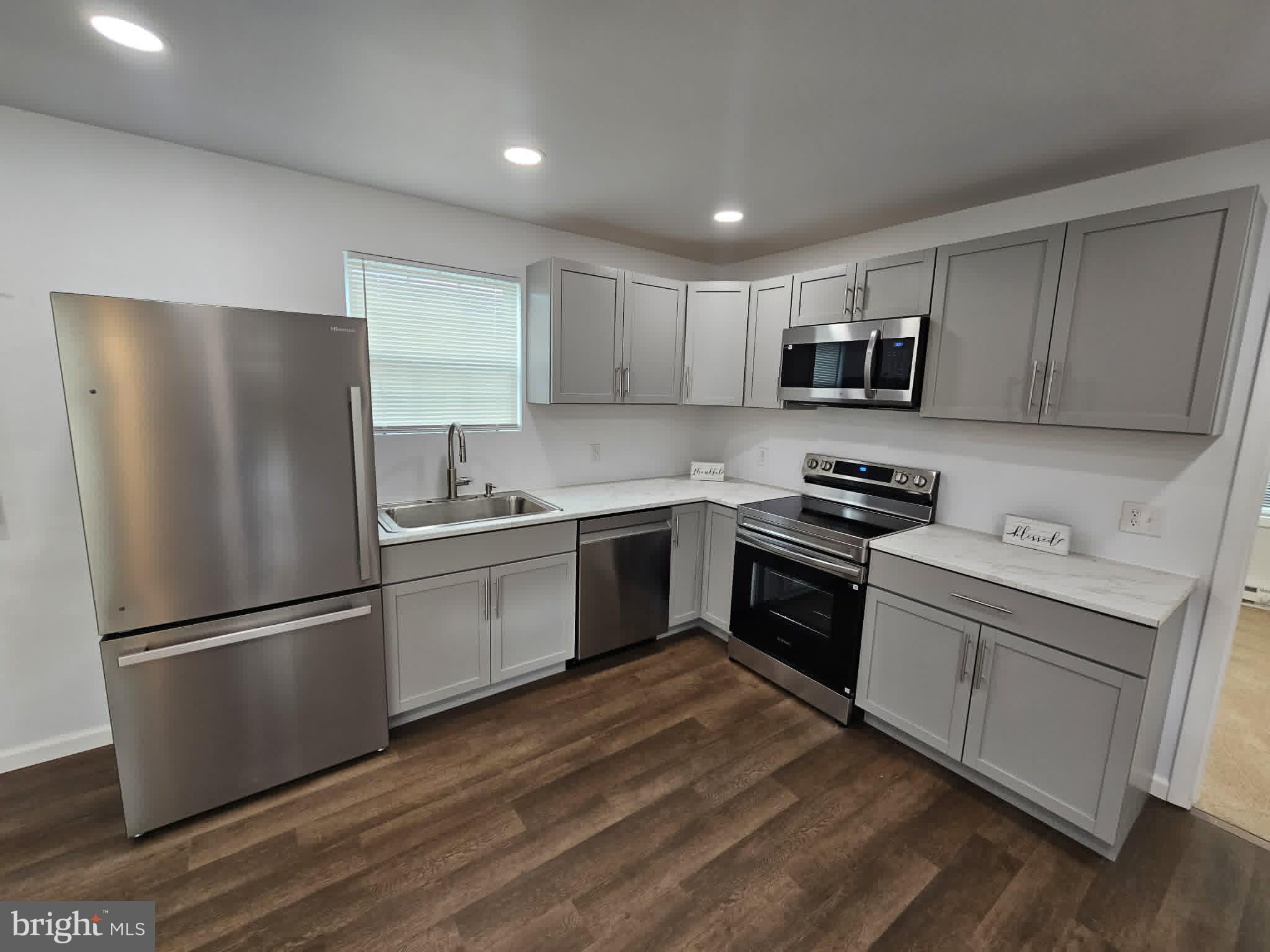 30 South Skyline Drive Ridgeley, WV 26753 - Photo 6 of 15 a kitchen with a refrigerator stove and white cabinets