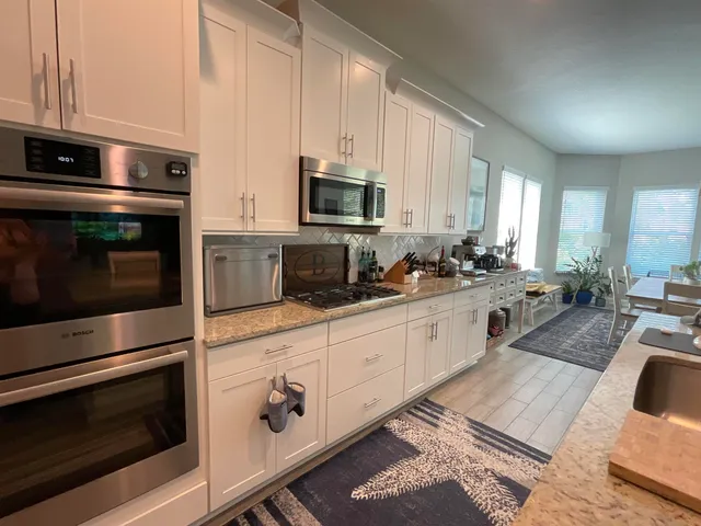 a view of a park with large trees