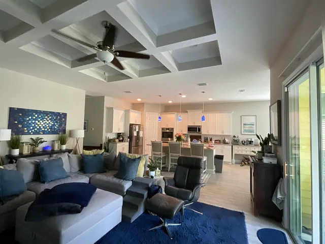 a kitchen with stainless steel appliances granite countertop a refrigerator stove and sink