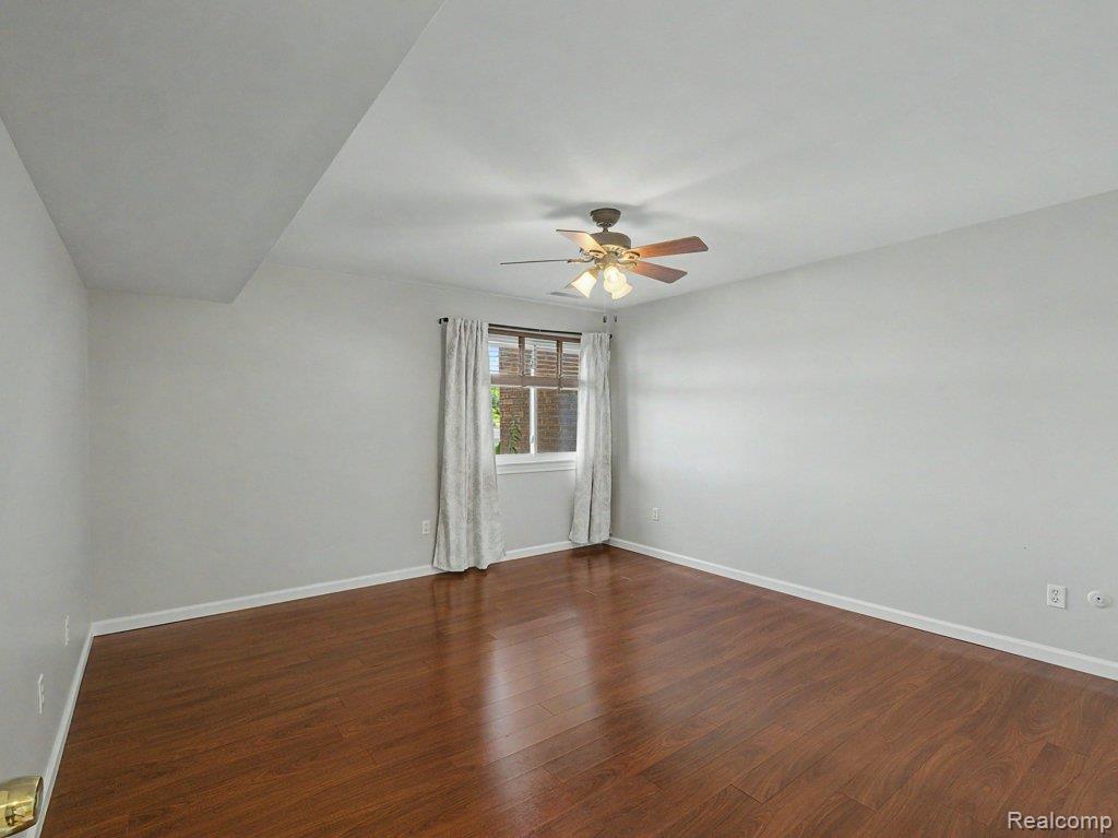 1974 Klingensmith Road, Unit 4 Bloomfield Hills, MI 48302 - Photo 18 of 35 Hardwood-finish flooring complements light-toned walls
