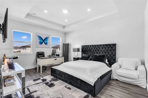 a large white bed in a white room