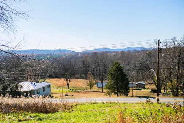 a backyard of a house with large trees