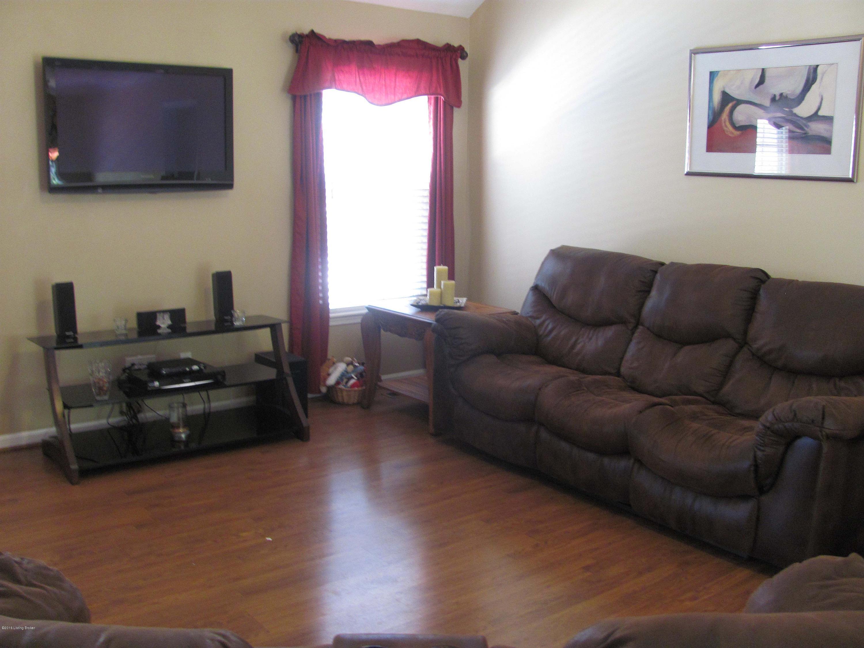 10010 Rimfire Road Louisville, KY 40291 - Photo 8 of 26 Great Room with Laminate Flooring