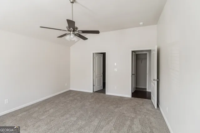 a bathroom with a tub a sink and a large mirror