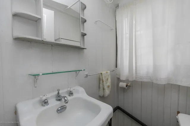a bathroom with a sink and a toilet