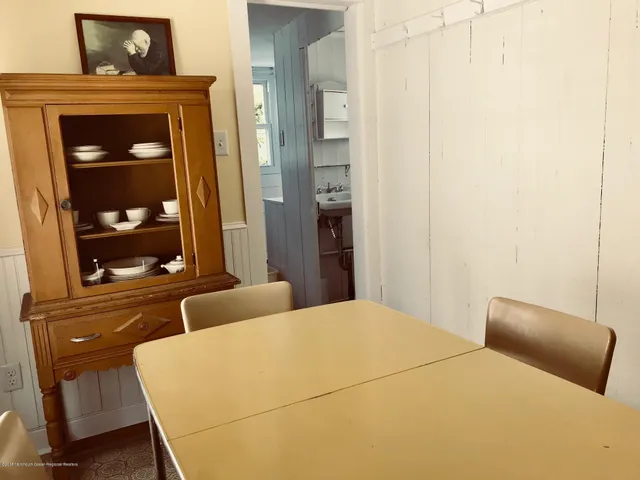 a bedroom with a bed and with furniture