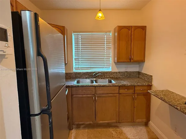 a bathroom with a sink and a large mirror