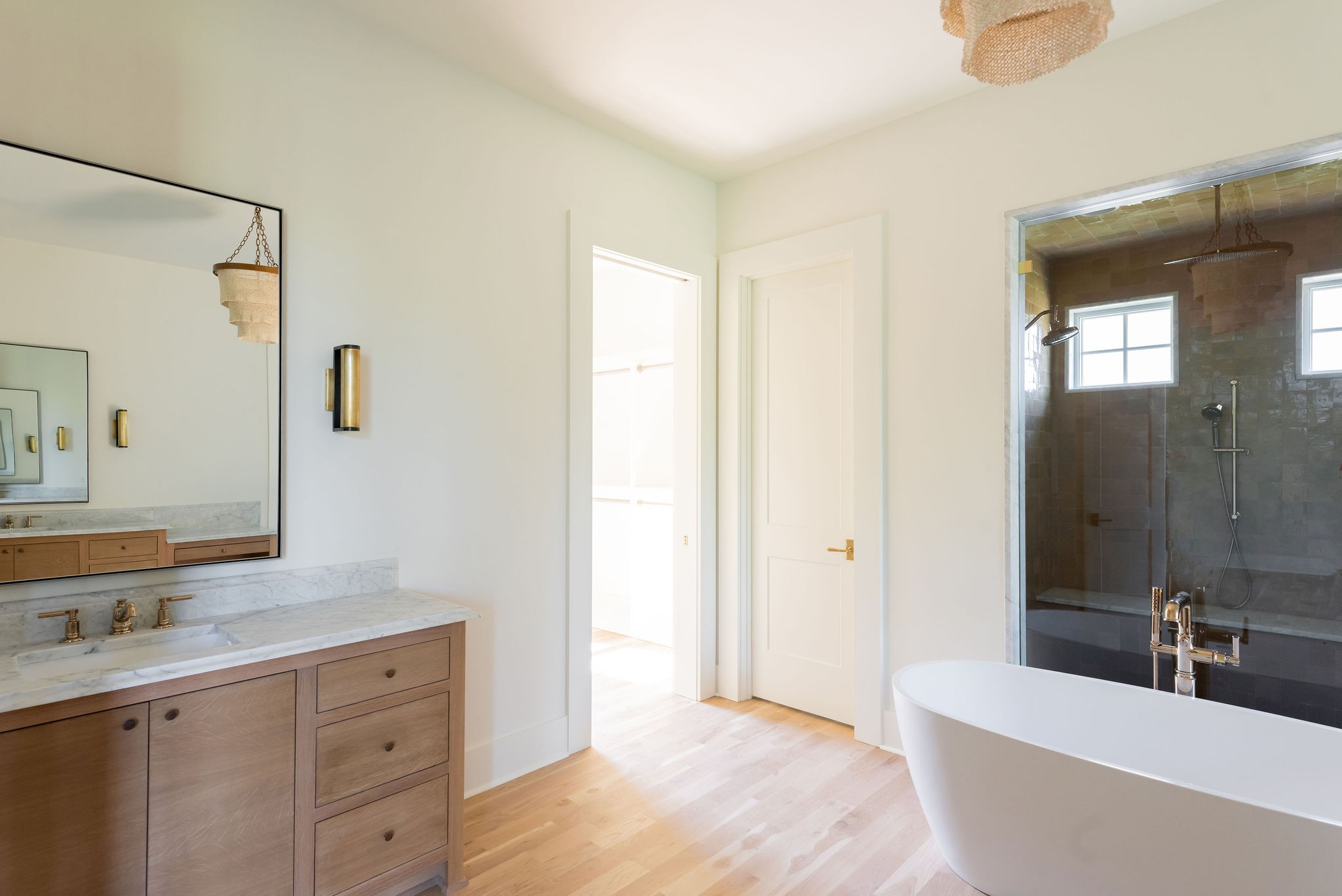 8182 Heirloom Boulevard College Grove, TN 37046 - Photo 19 of 34 a spacious bathroom with a tub sink and mirror