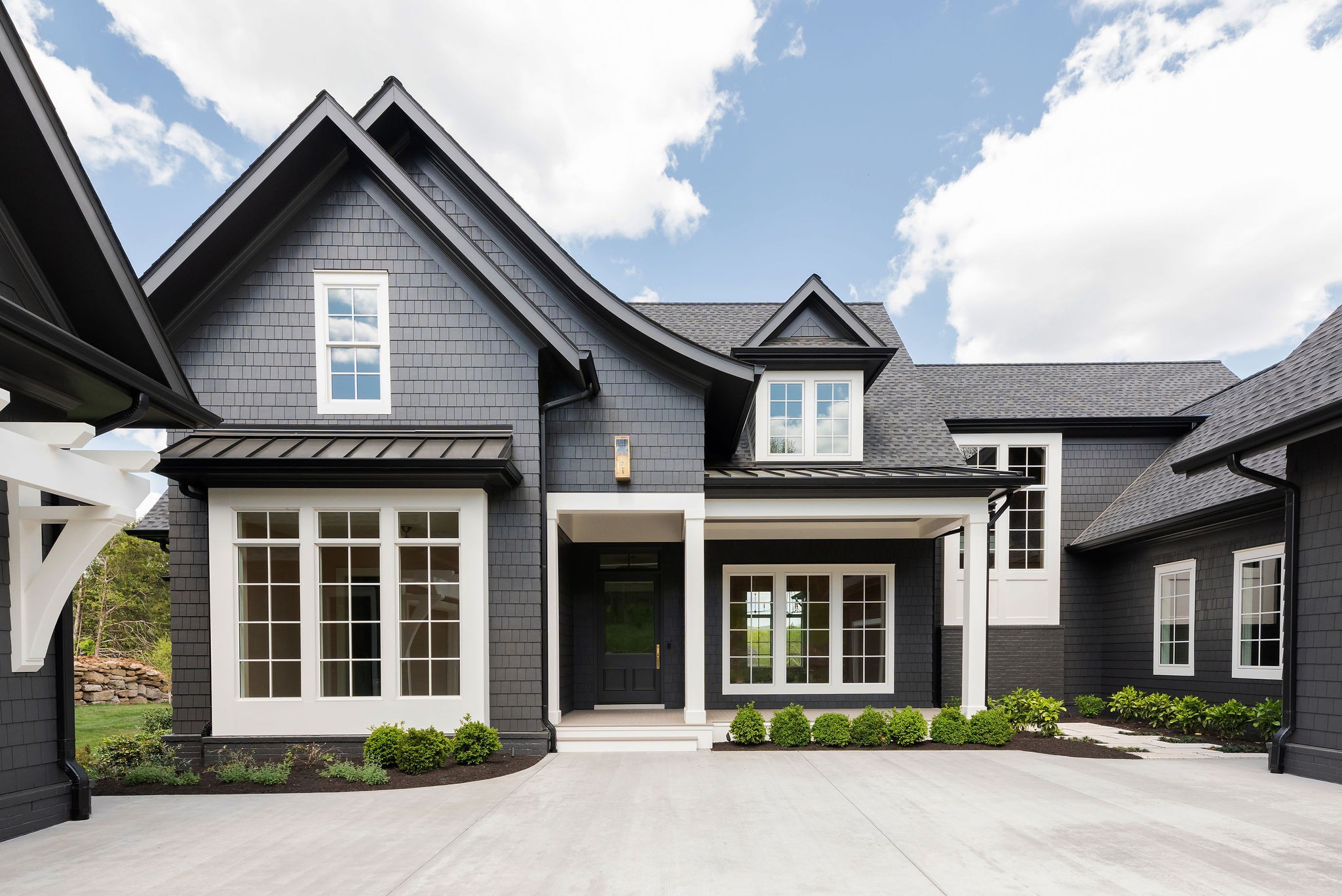 8182 Heirloom Boulevard College Grove, TN 37046 - Photo 3 of 34 a front view of a house with garden