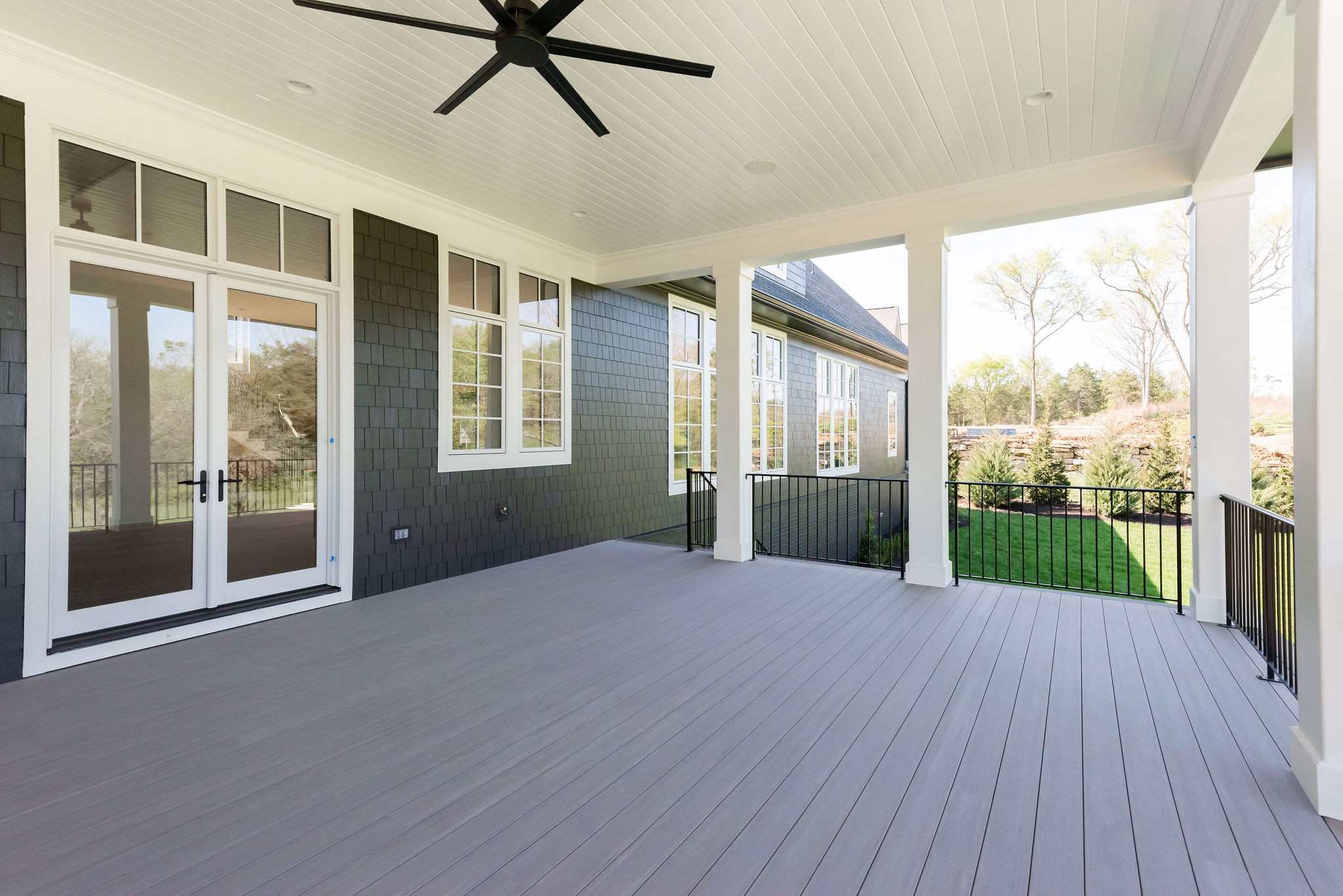 8182 Heirloom Boulevard College Grove, TN 37046 - Photo 33 of 34 a view of a porch with wooden floor and garden