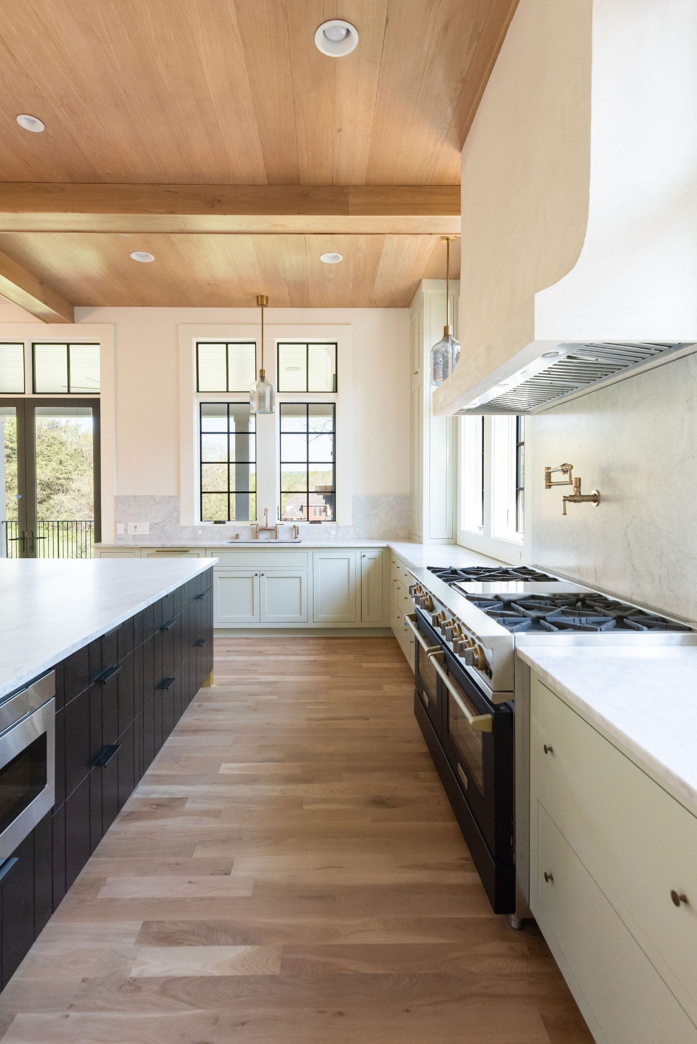 8182 Heirloom Boulevard College Grove, TN 37046 - Photo 9 of 34 a large kitchen with granite countertop a stove and a sink