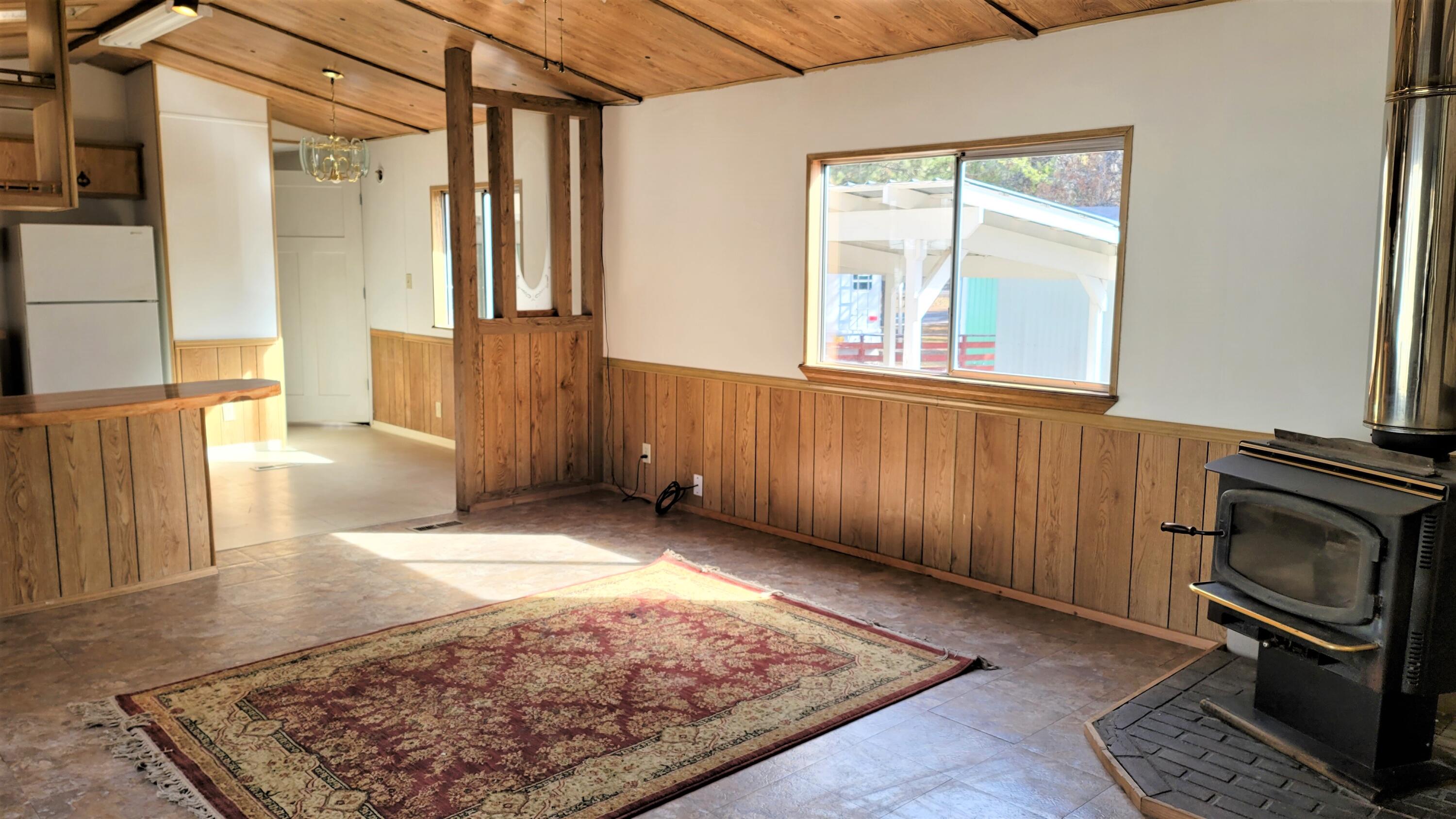 52731 Huntington Road, Unit 22 La Pine, OR 97739 - Photo 4 of 22 Great room has cozy wood stove in the corner