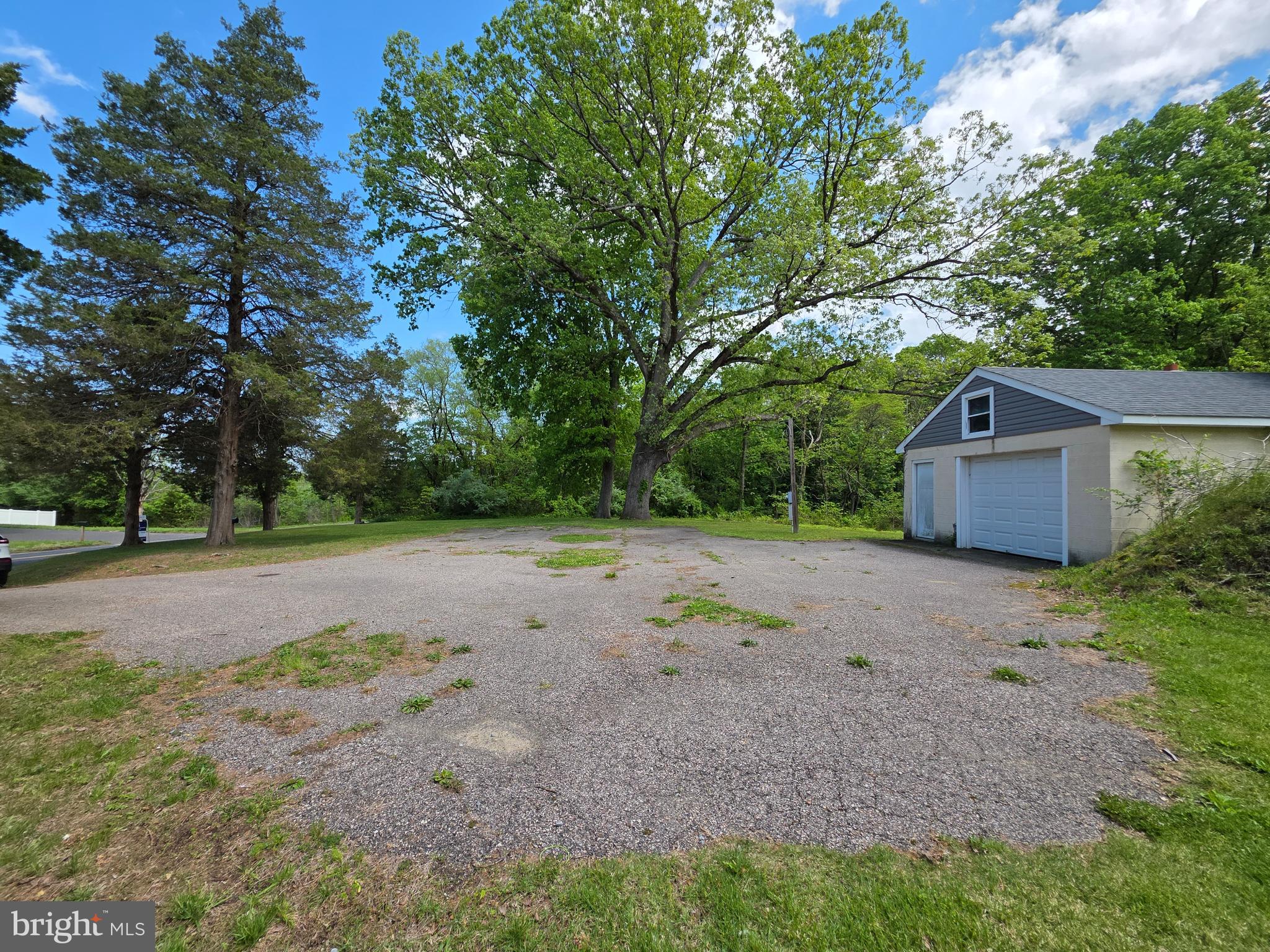 18 West Factory Road Berlin, NJ 08009 - Photo 2 of 8 a view of a backyard with large trees