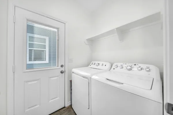 a utility room with dryer and washer